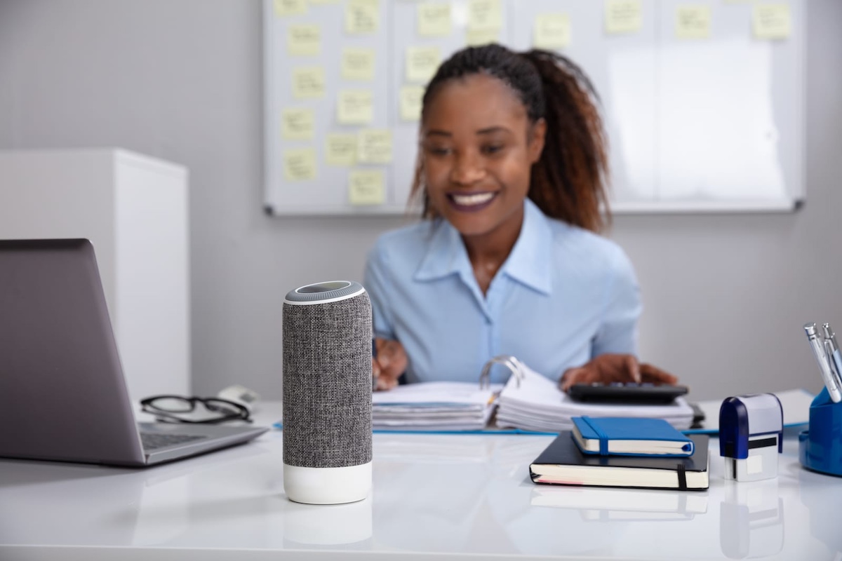 woman talking to alexa showing how to set up smart home with alexa