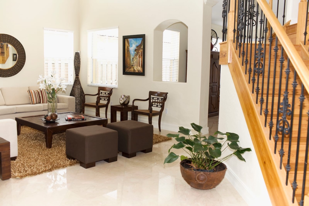 Living room with stairs where a robot vacuum for multiple floors can work