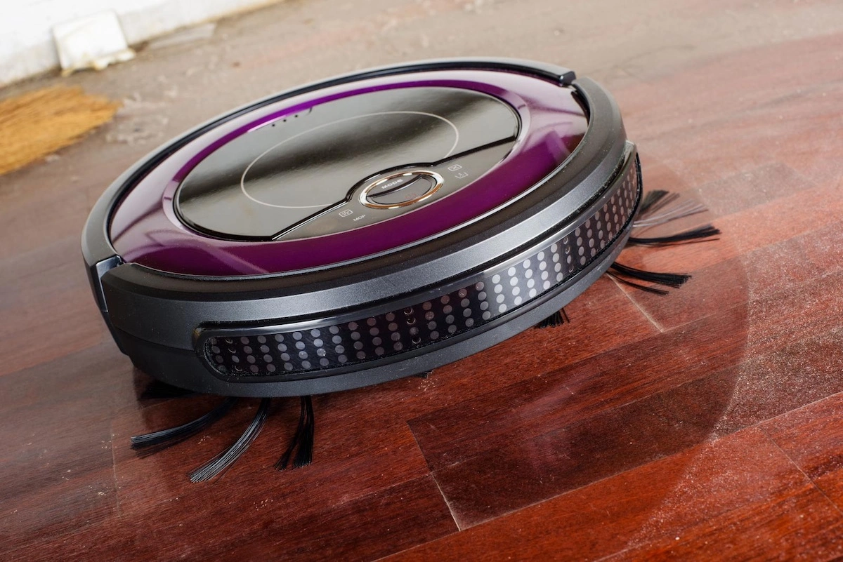 robot vacuum cleaning a dusty hardwood floor